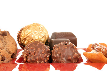sweets on red glass plate