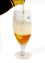 Glass beer with foam on white background
