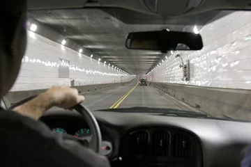 Rolgordijnen Driving in a tunnel, between US and Canada © Vladimir Mucibabic