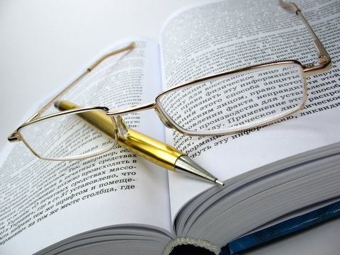 glasses & pen on book 2