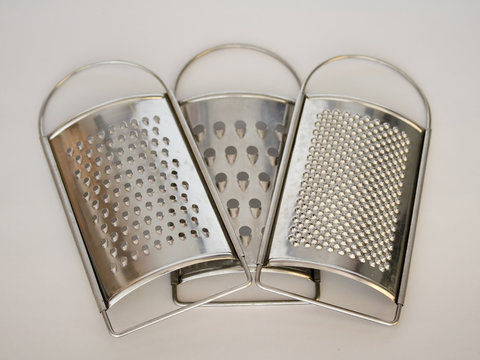three chrome stainless grater    on white background 