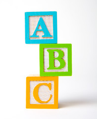 Wooden alphabet blocks stacked © Vivid Pixels