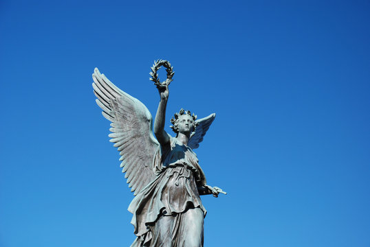 An angel reaching into the sky