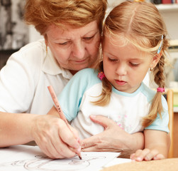Grandma and grand-daughter painting