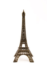 Fototapeta na wymiar Mała figurka z brązu wieży Eifel