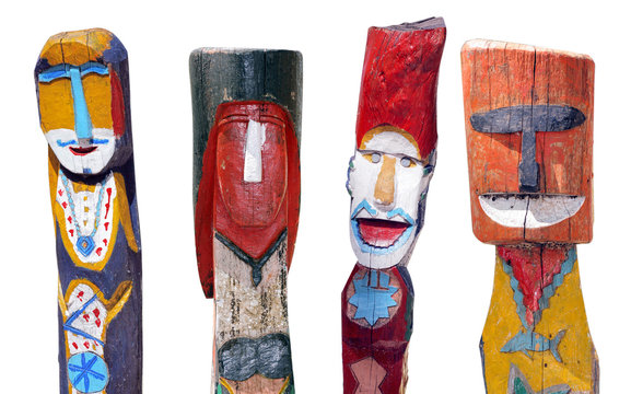 four moken totems on white background