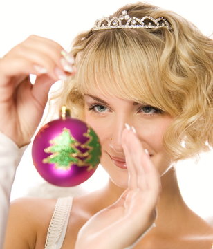 Beautiful blond girl with Christmas-tree decorations (shallow Do