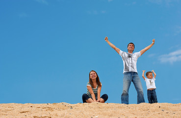 Happy three on top of sand dune
