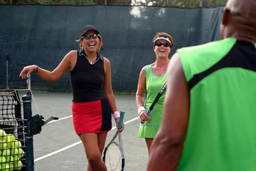 Foto op Canvas female tennis players laughing © tracyhornbrook