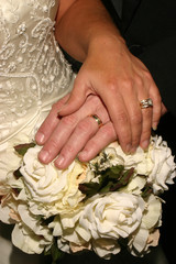 Married Hands on White Flowers