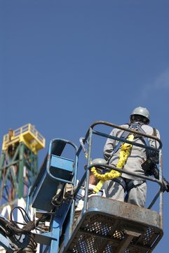 Photographer Eyes Drilling Rig From Manlift