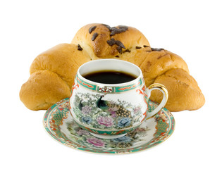 The cup coffee and croissant