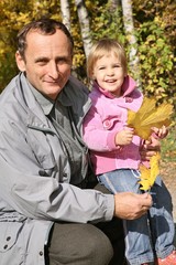 grandfather with the granddaughter in the park 