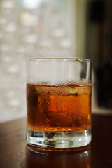 glass of whisky with an ice