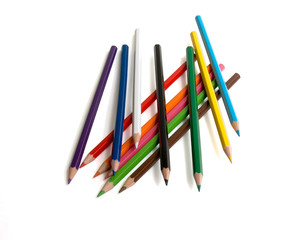 The multi-coloured pencils lay on a white background