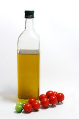 Cherry tomatos  with bottle of olive oil