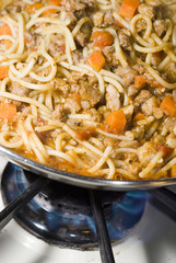 spaghetti bolognese cooking on stove