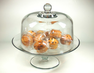 Individully wrapped choclate chip muffins on cake stand