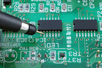 test probe on a printed circuit board checking faults