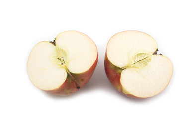Still life of sliced red apples on white background