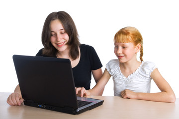 Two girls using a laptop