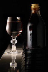 home made liquor of jabuticaba, bottle and glass © dethchimo