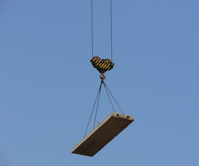 Construction crane - hook lifting concrete plate