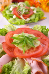 Fresh salad with onion, tomato and basil