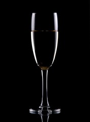 Glass of wine isolated over black background
