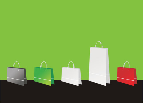 Shopping bags on green background