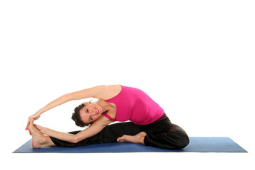 Obraz premium Woman Stretching On A Yoga Mat