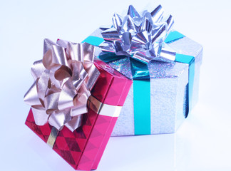 Shiny presents with ribbons and bows on white background.