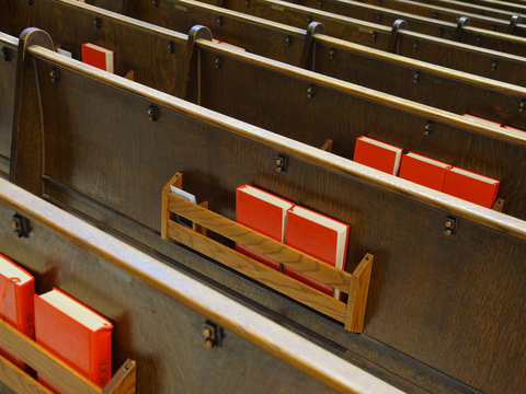 Catholic church benches and Bible books