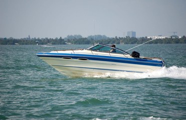 Fototapeta premium White and Blue Motor Boat