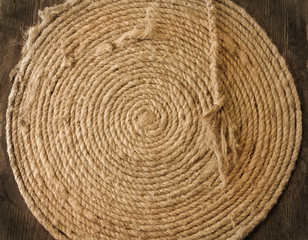 Fototapeta na wymiar Coiled line of boat rope on wood background