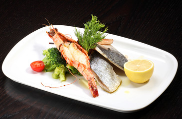 Delicious plate of prawns and fish fillet