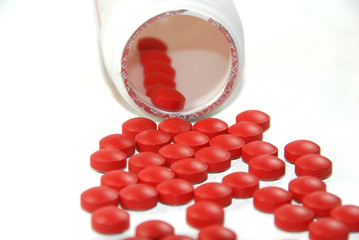 red pills on white background