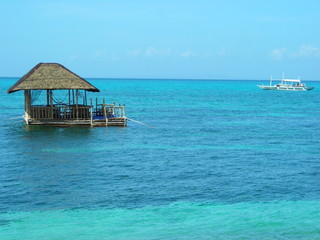 Floating hut on the shores of tropical Island