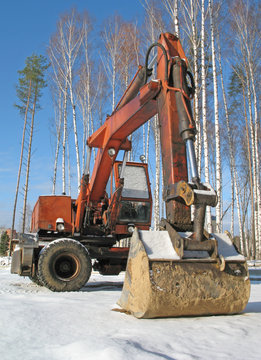 Excavator under snow