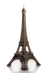 Small bronze of Eiffel tower figurine isolated on white backgrou