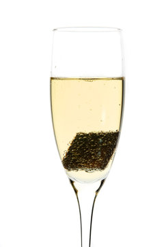Glass of champagne with piece of chocolate inside