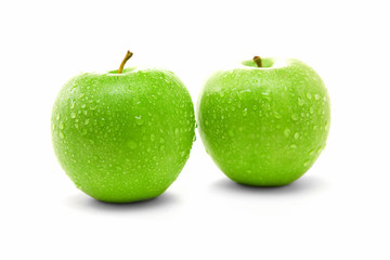 Two juicy green apples isolated on white background