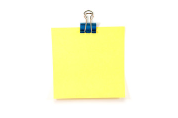 Yellow note with a binder clip, Isolated on white.