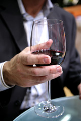 The man suggests to drink red wine