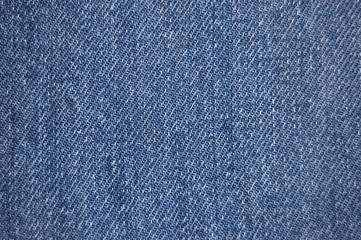 Naklejka premium Blue stone-washed denim fabric texture