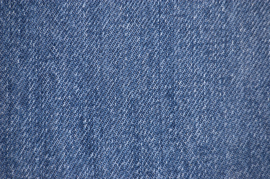 Blue stone-washed denim fabric texture