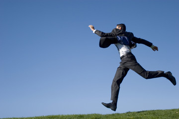 Businessman jumping