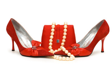 Red shoes, purse and pearl necklace isolated