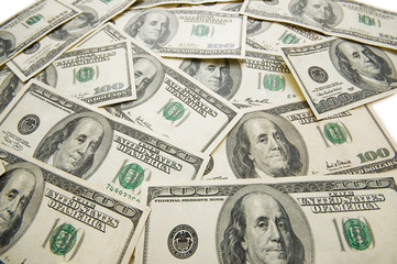 Lots of dollar bank notes scattered on the table