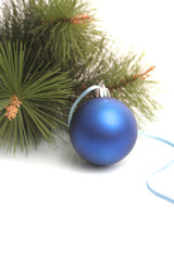 Obraz na płótnie Canvas Dark blue New Year's sphere and pine branch